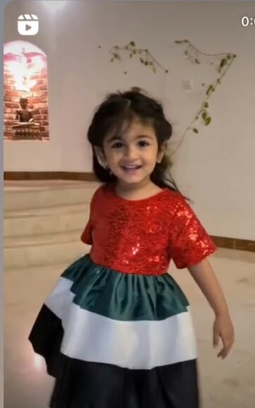 Ready for UAE National Day in her flag dress.